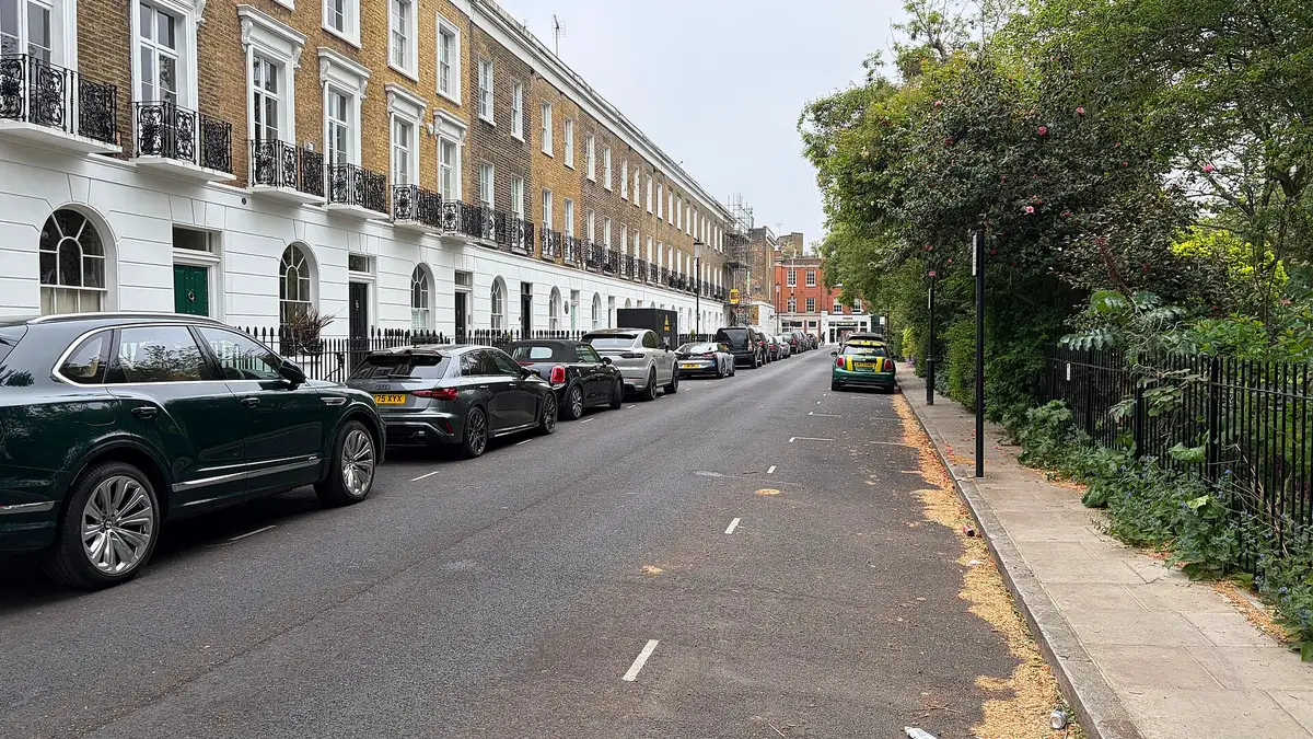 A stucco and brick terrace with iron balconies on Paultons Square, Chelsea