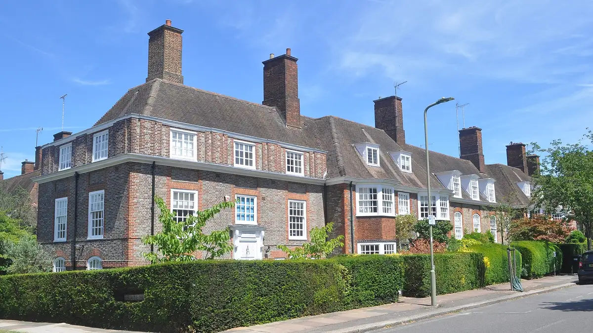 Arts and Crafts brick houses with tall chimneys on North Square, Hampstead Garden Suburb
