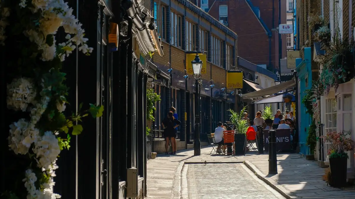 A cobbled lane lined with shops in Hampstead village