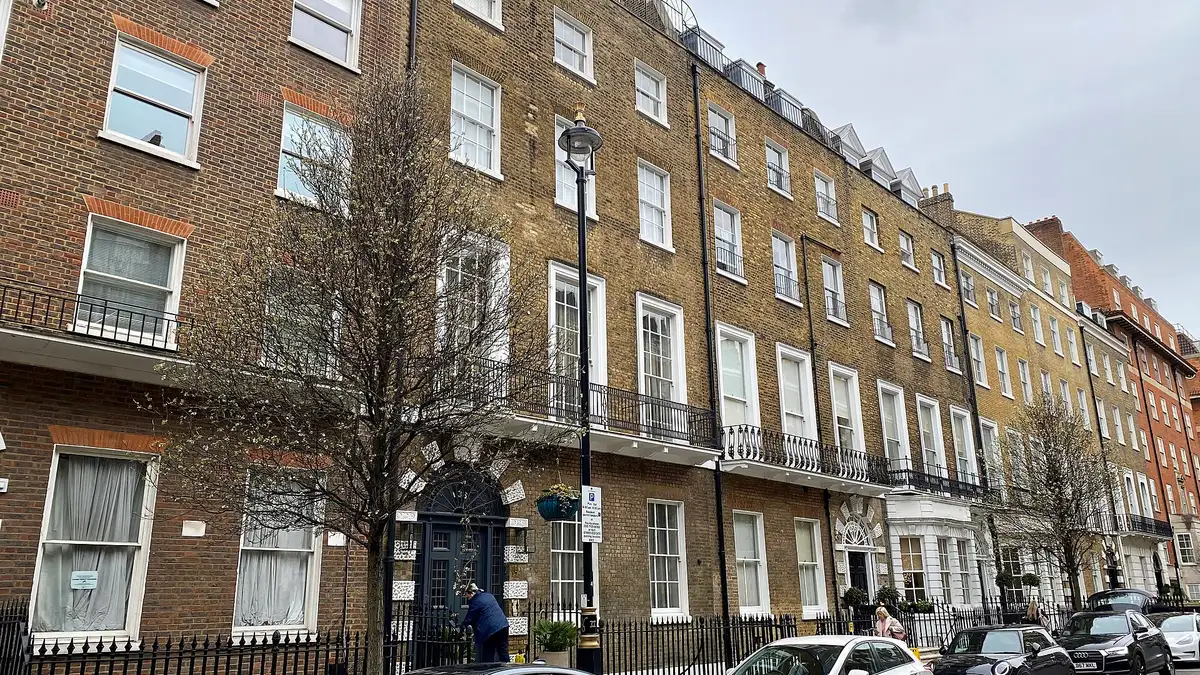 A Georgian brick terrace with iron balconies on Harley Street, Marylebone