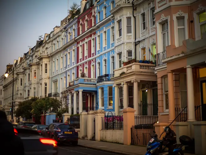 Pastel-painted stucco terraced houses on Colville Terrace, Notting Hill