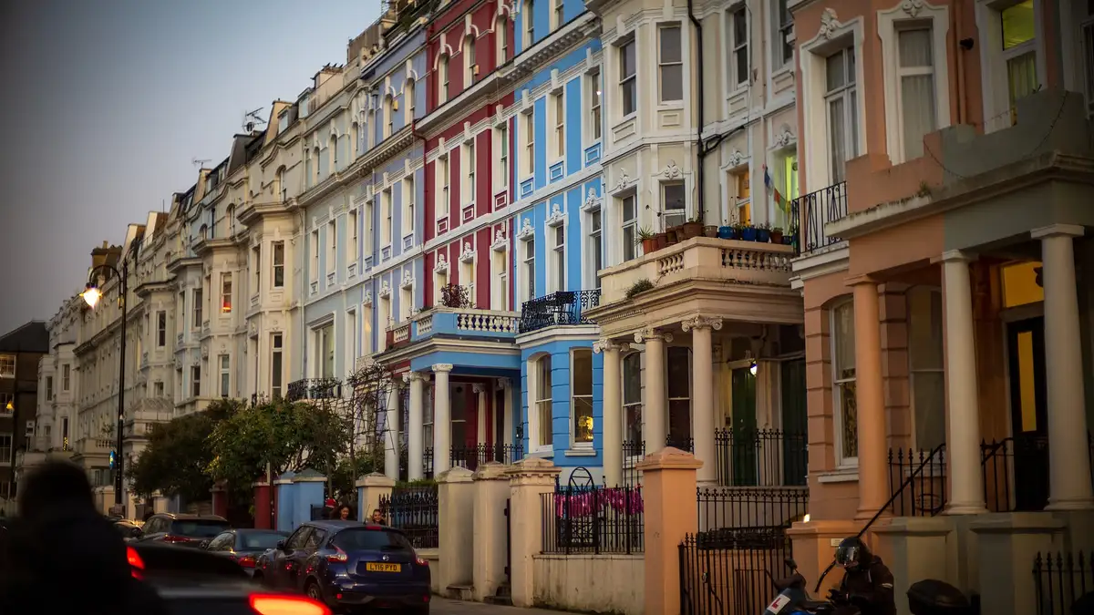 Pastel-painted stucco terraced houses on Colville Terrace, Notting Hill