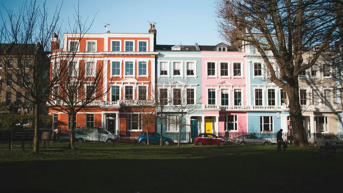 A row of pastel-painted terraced houses in Primrose Hill