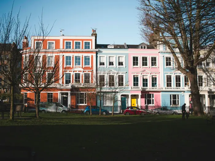 A row of pastel-painted terraced houses in Primrose Hill